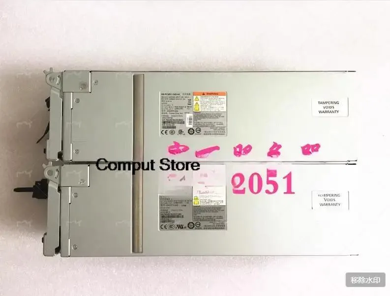 Rectangular silver metal power supply unit with ventilation grille and label showing model numbers