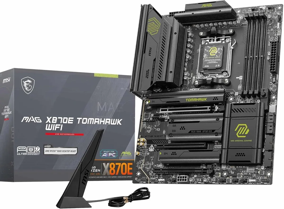 ATX motherboard in black and silver with large VRM heatsinks, M.2 shields and rear I/O cover