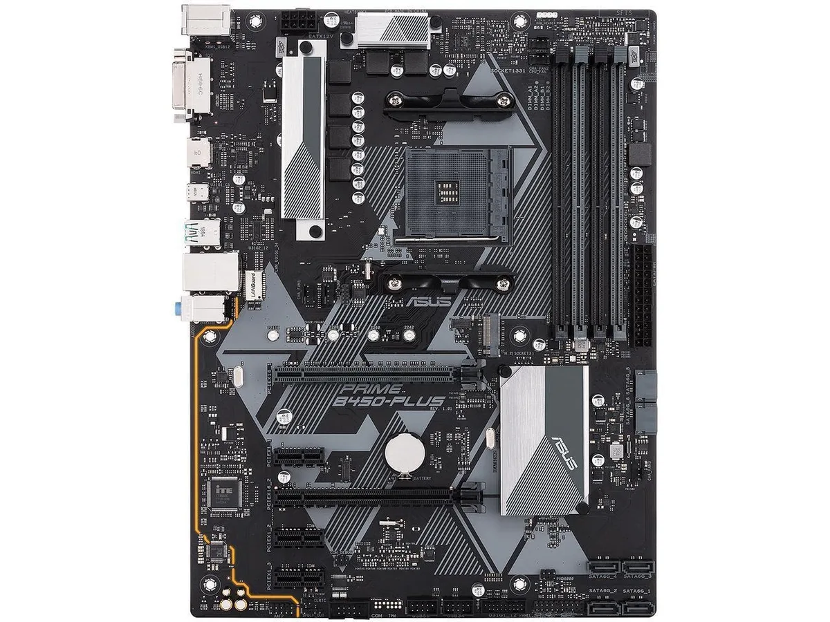 ATX motherboard in dark grey with silver heatsinks and RGB headers