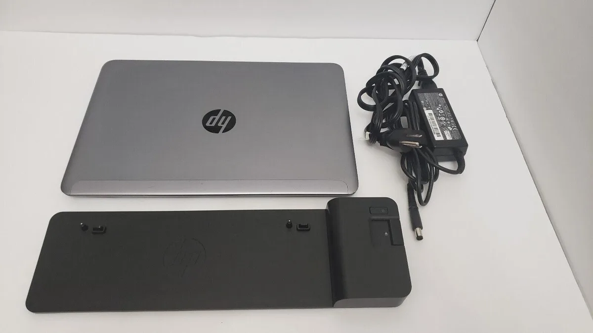 Silver HP EliteBook Folio 1040 G1 14.1 inch laptop with docking station