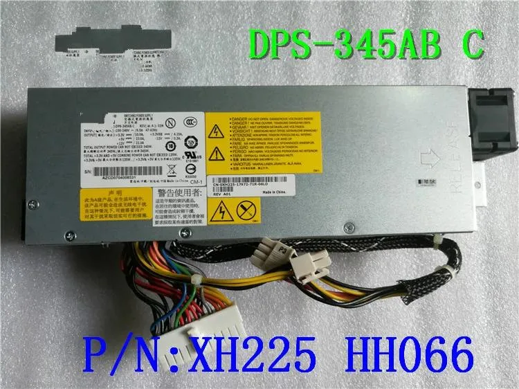 Rectangular silver ATX power supply unit with ventilation grille and label showing model numbers