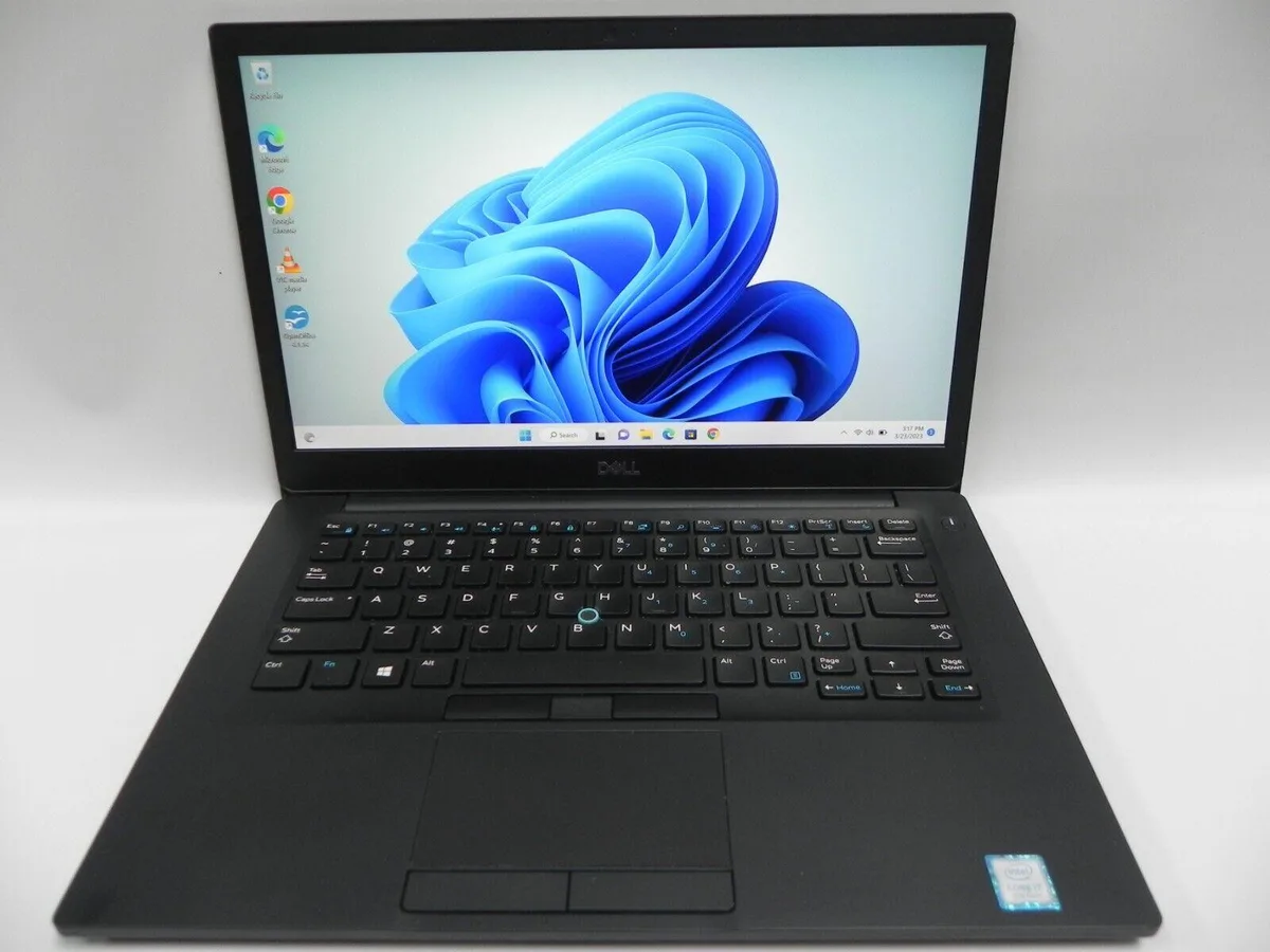 Silver Dell Latitude 7490 laptop closed on desk