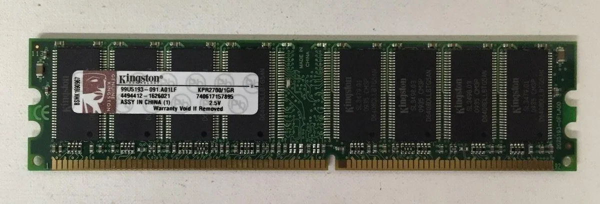 Green circuit board with black memory chips and gold edge connector