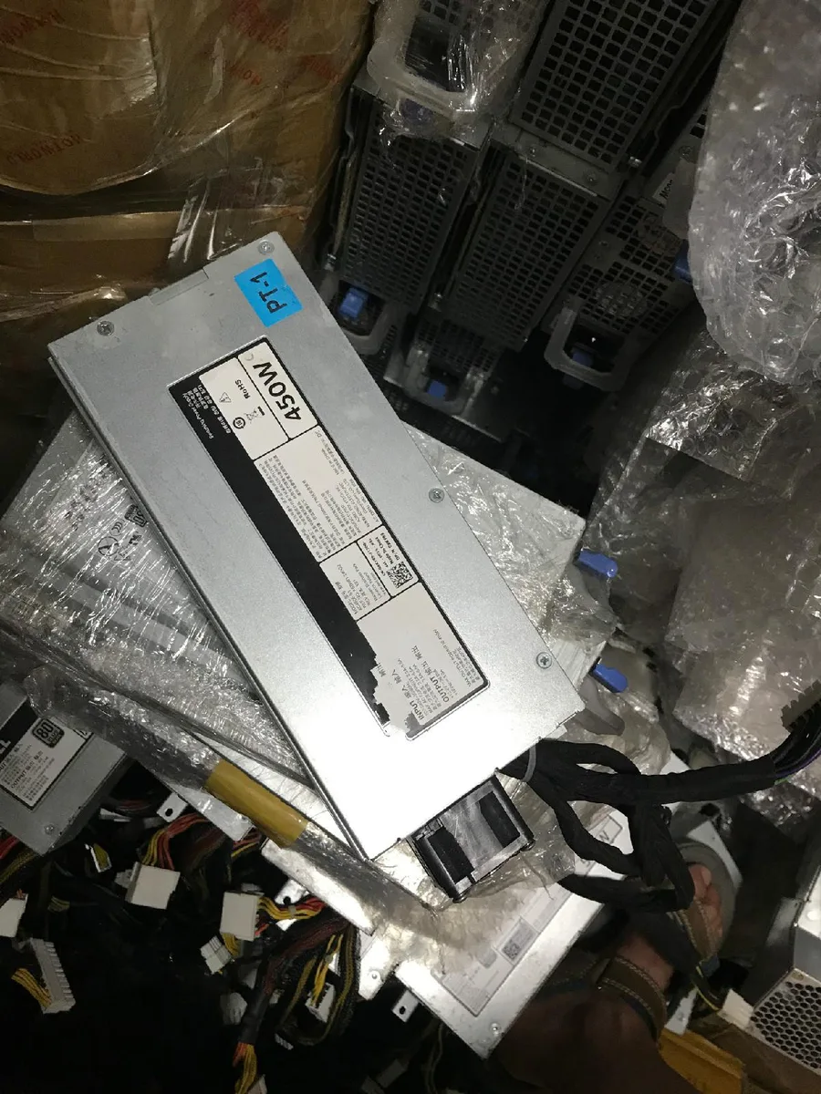Rectangular silver server power supply unit with rear fan grille and power socket