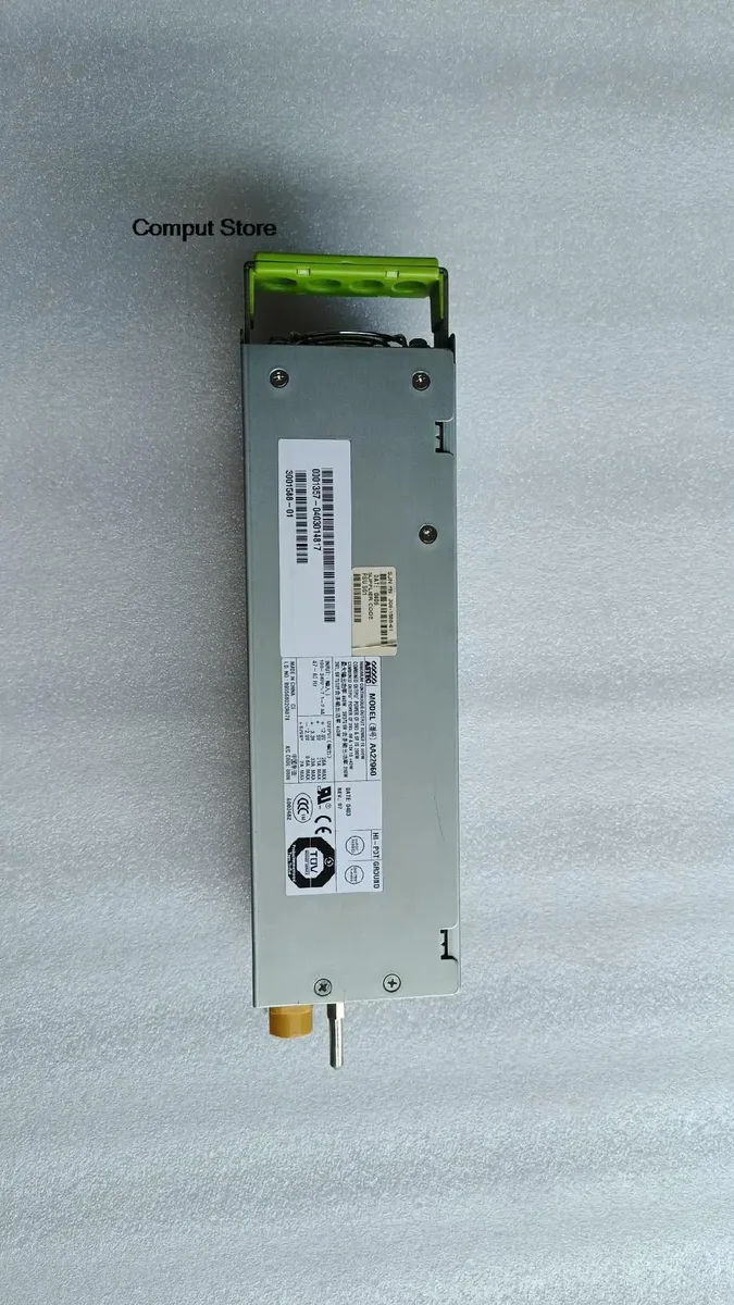 Rectangular silver power supply unit with rear fan grille and multiple connectors