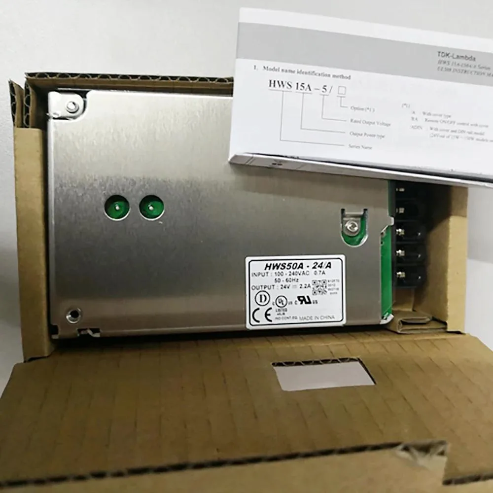 Compact rectangular switching power supply unit in metal casing with terminal connections
