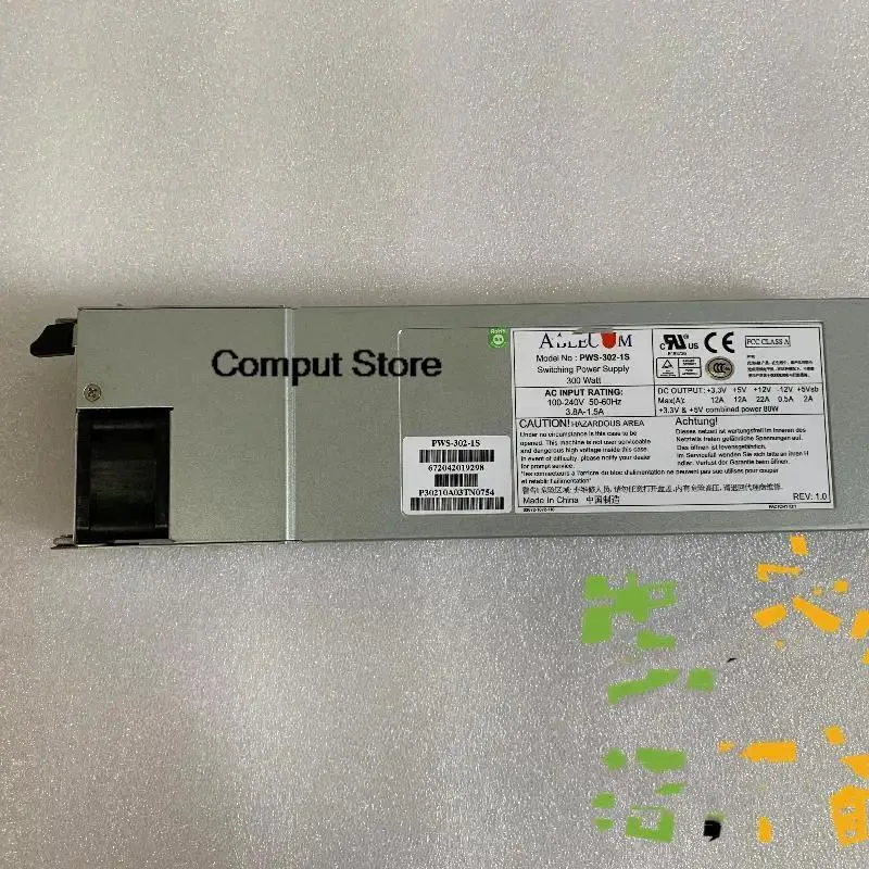 Silver 1U server power supply module with rear fan grille and power connector