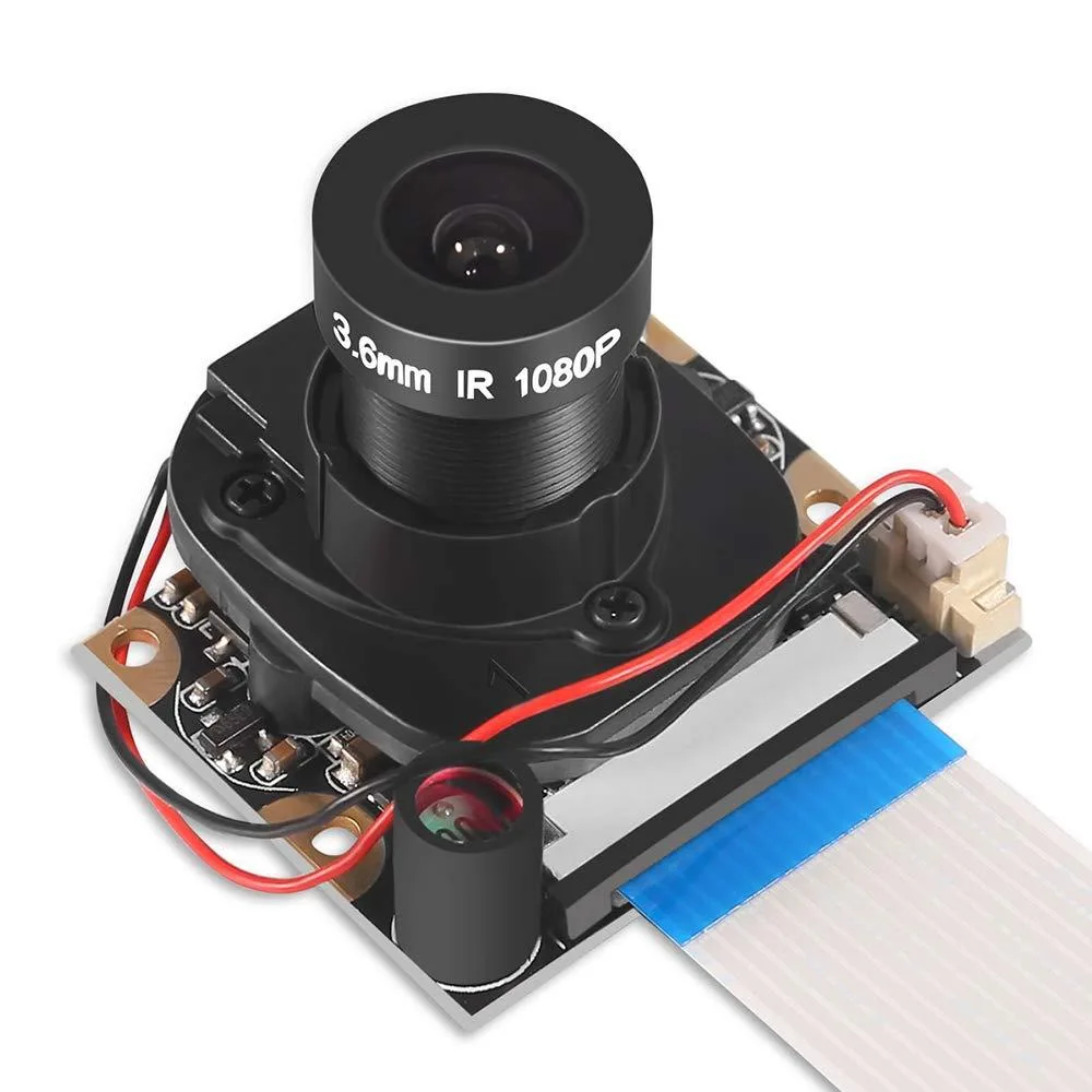 Small black rectangular camera board with round lens and silver screw holes on green PCB