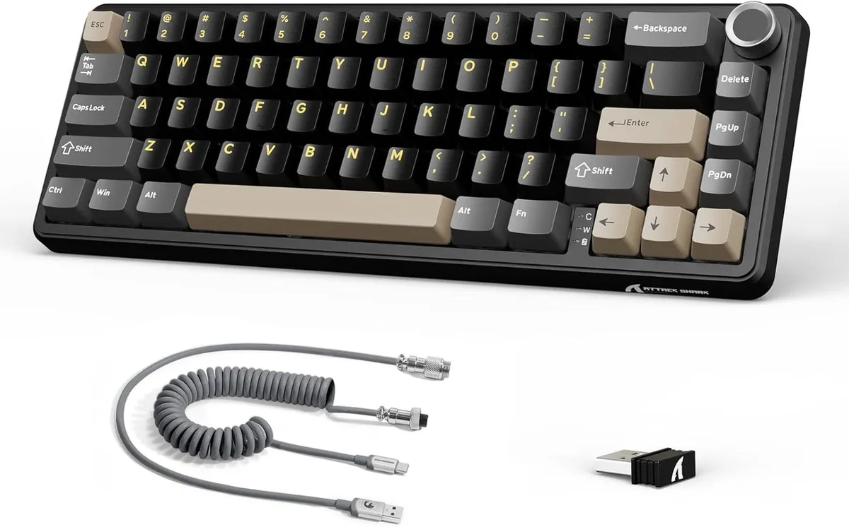 Compact 60 percent mechanical keyboard in star black with metal volume knob and coiled cable