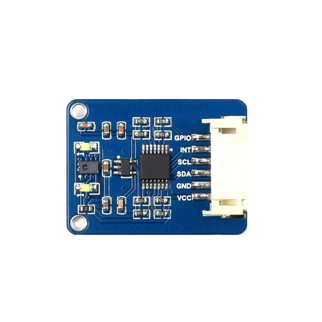 Small green PCB with silver sensor chip and two white LEDs