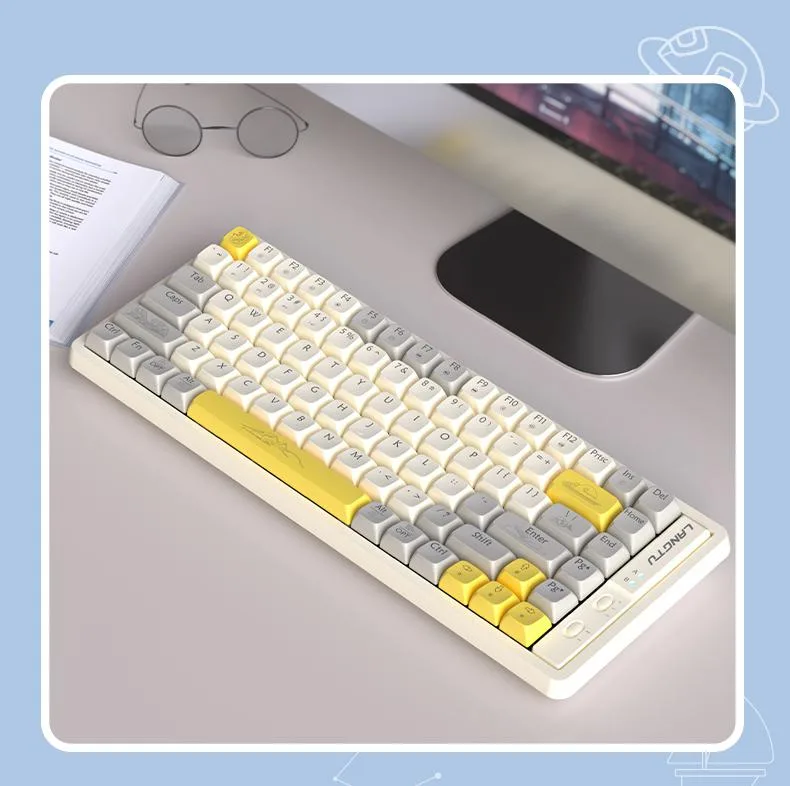 Compact 85-key mechanical keyboard in yellow and white with ABS keycaps and rainbow backlighting