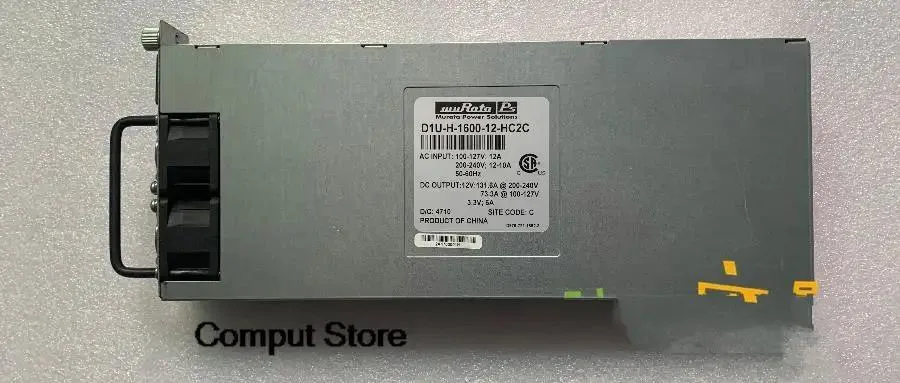 Rectangular silver metal power supply unit with label visible