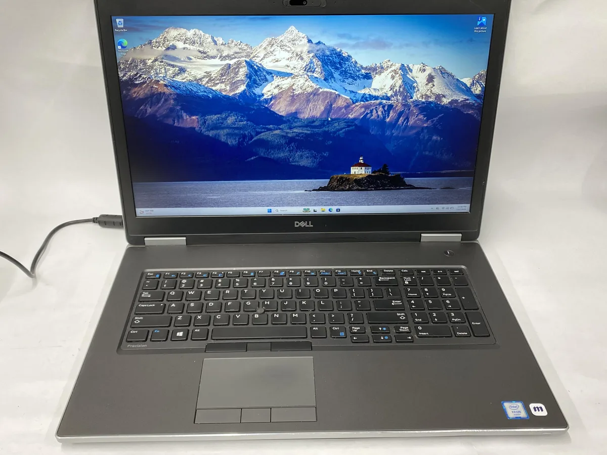 Silver 17-inch Dell Precision 7740 mobile workstation with charger