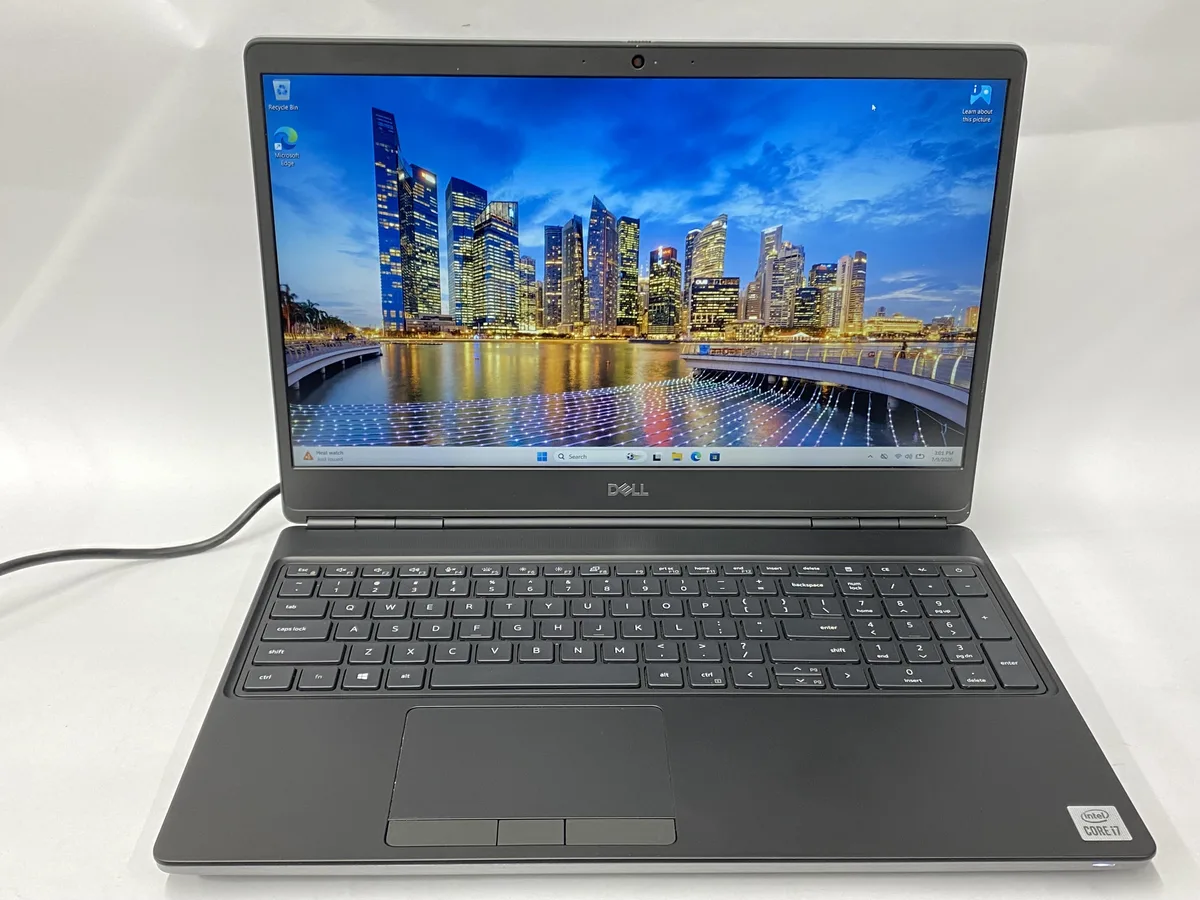 Silver Dell Precision 7550 laptop closed, visible scratches on lid and base