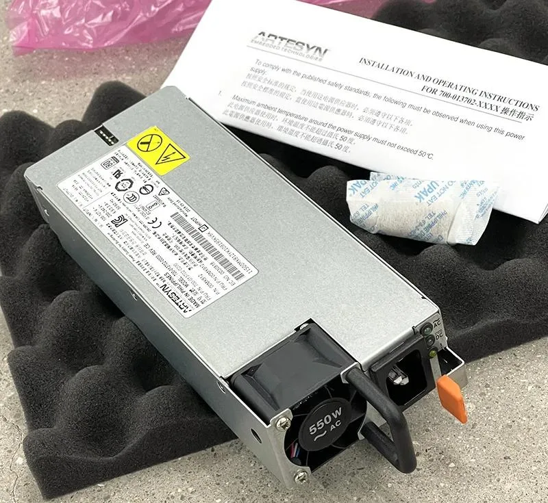 Silver rectangular ATX power supply unit with ventilation grille and label showing 550W