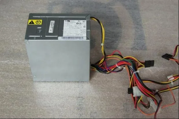 Rectangular metal ATX power supply unit with ventilation grille and label showing model PS-5281-7VR