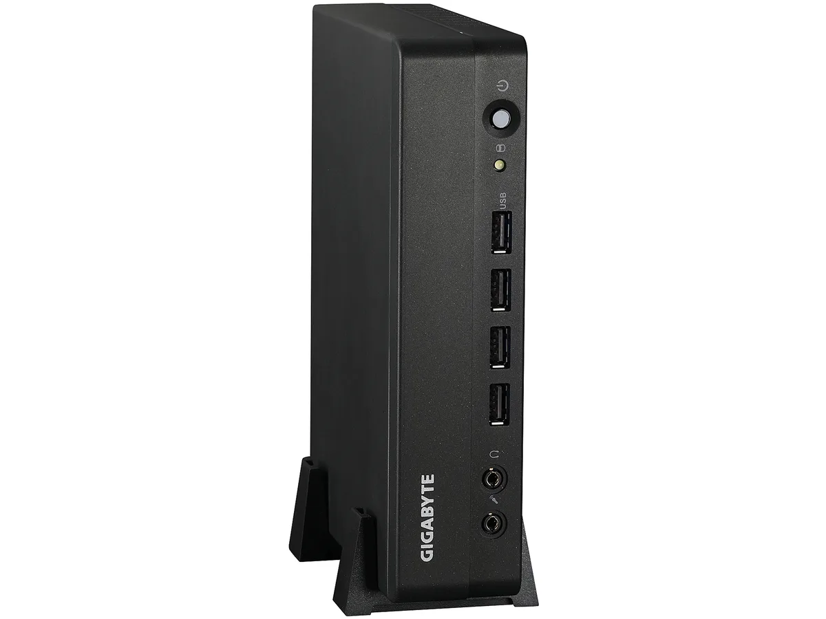 Small silver barebone mini PC with front power button and ports