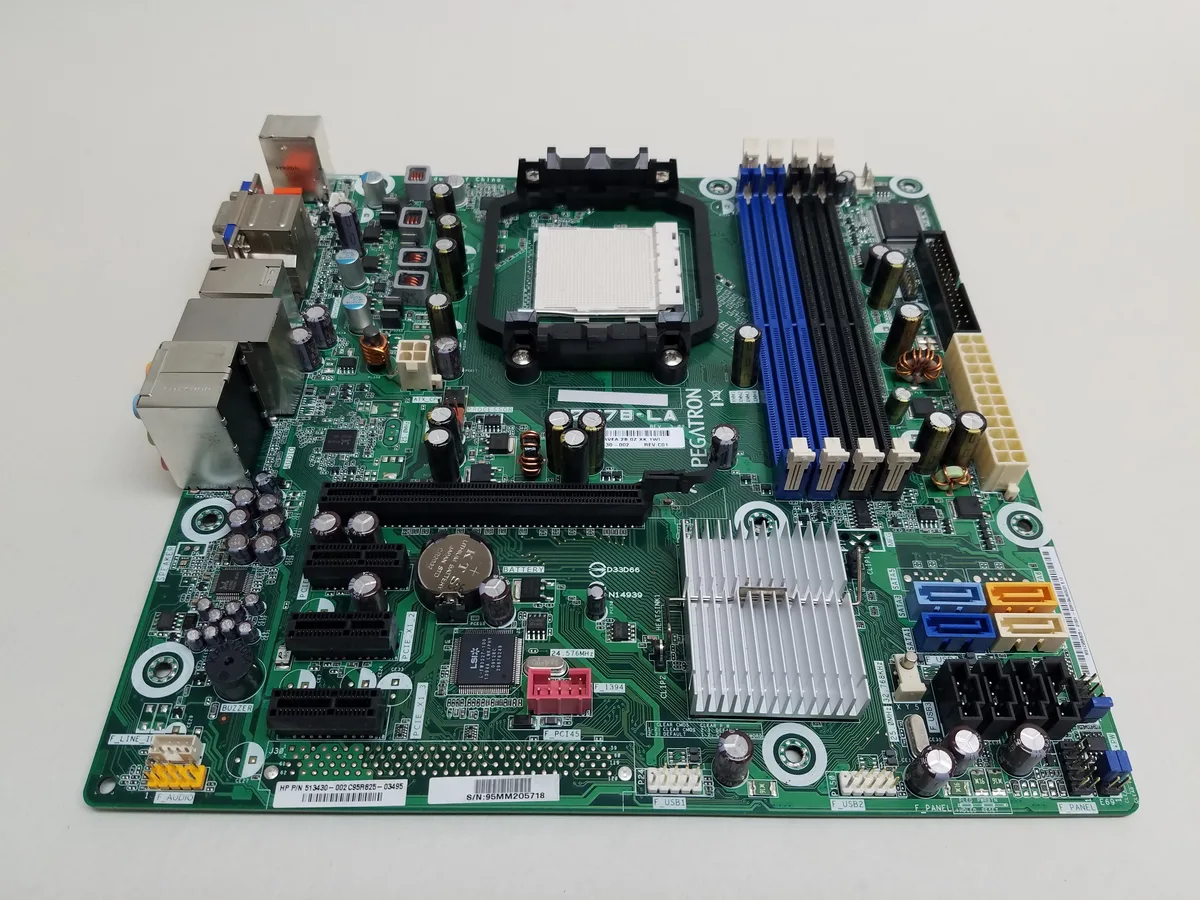 Green rectangular motherboard with silver ports and black slots