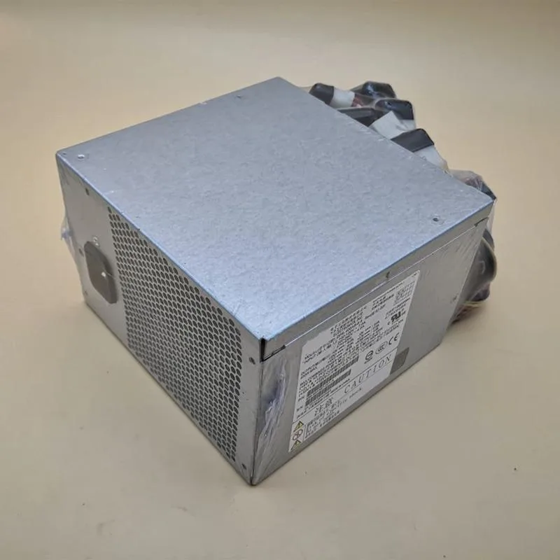 Silver rectangular ATX power supply unit with cooling fan grille and cable bundle
