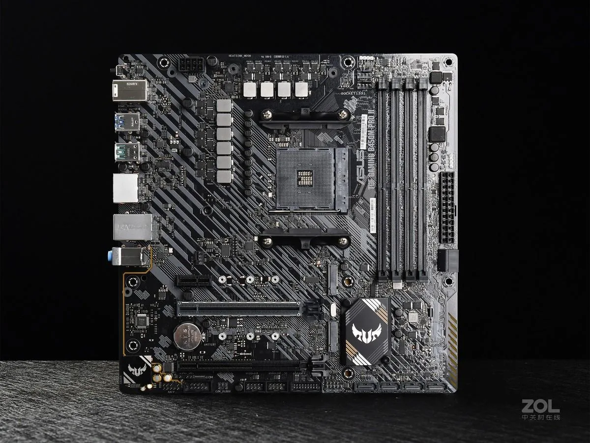 Green micro-ATX motherboard with black heatsinks and AM4 socket