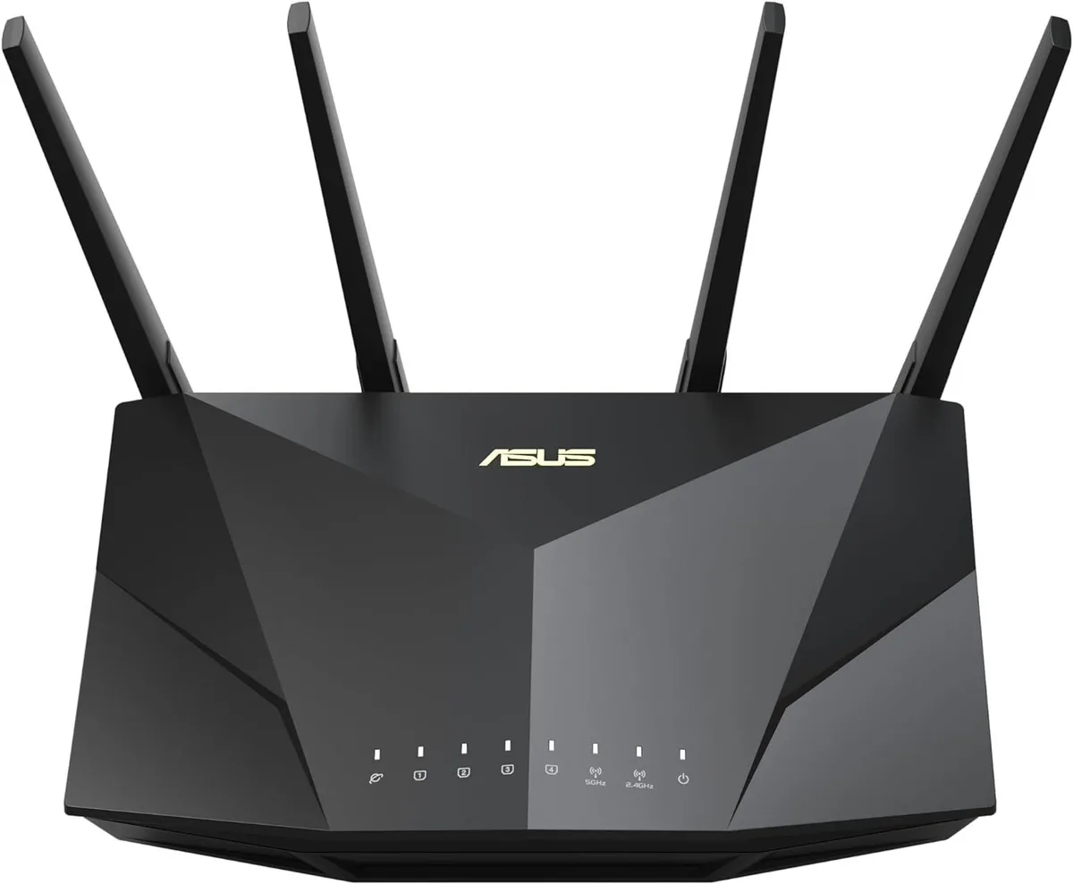 White rectangular router with four fixed external antennas and vented top surface