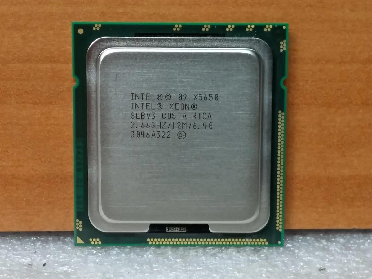 Intel Xeon X5650 server processor in LGA 1366 socket form factor with green PCB and gold contact pads