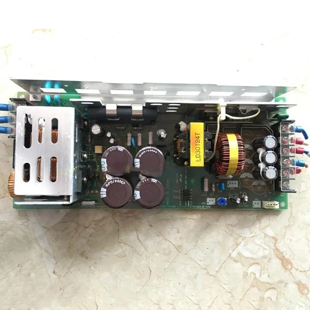 Open-frame switching power supply unit, silver metal chassis with components exposed