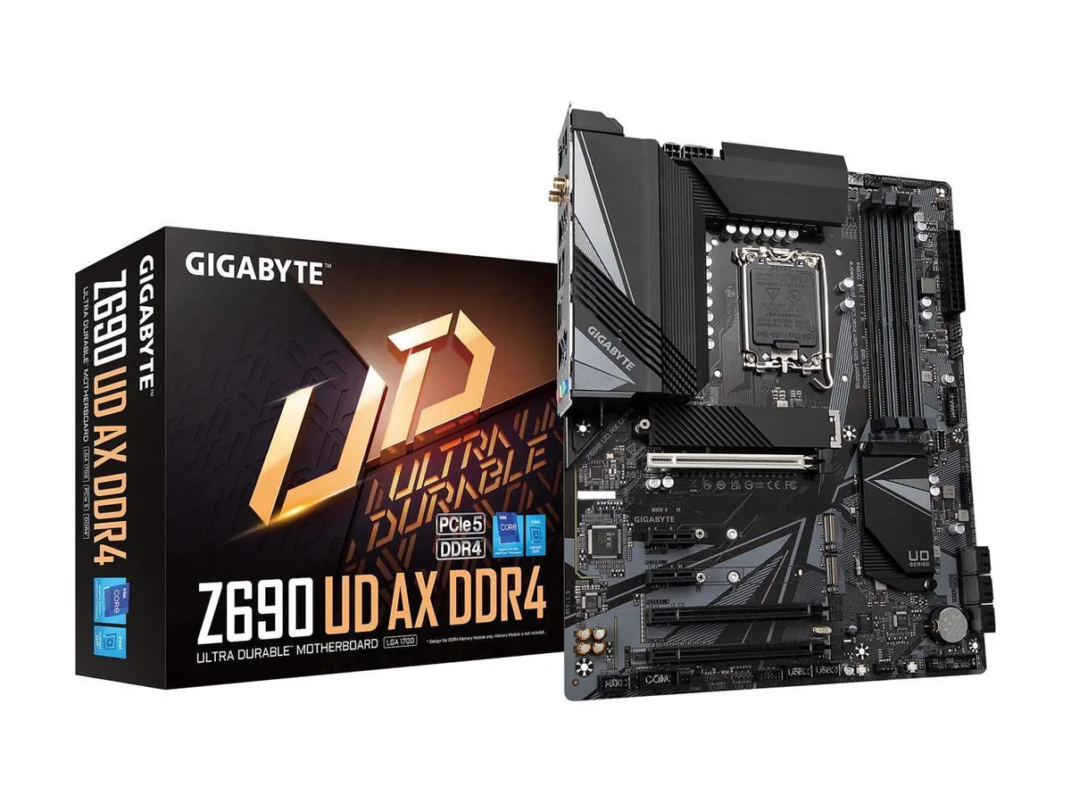 ATX motherboard, black PCB, silver VRM heatsinks, four DDR4 slots, LGA 1700 socket, triple M.2 covers, rear I/O shield integrated