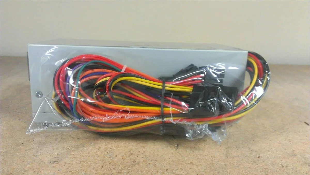 Compact TFX power supply unit with 80mm cooling fan and multiple connectors