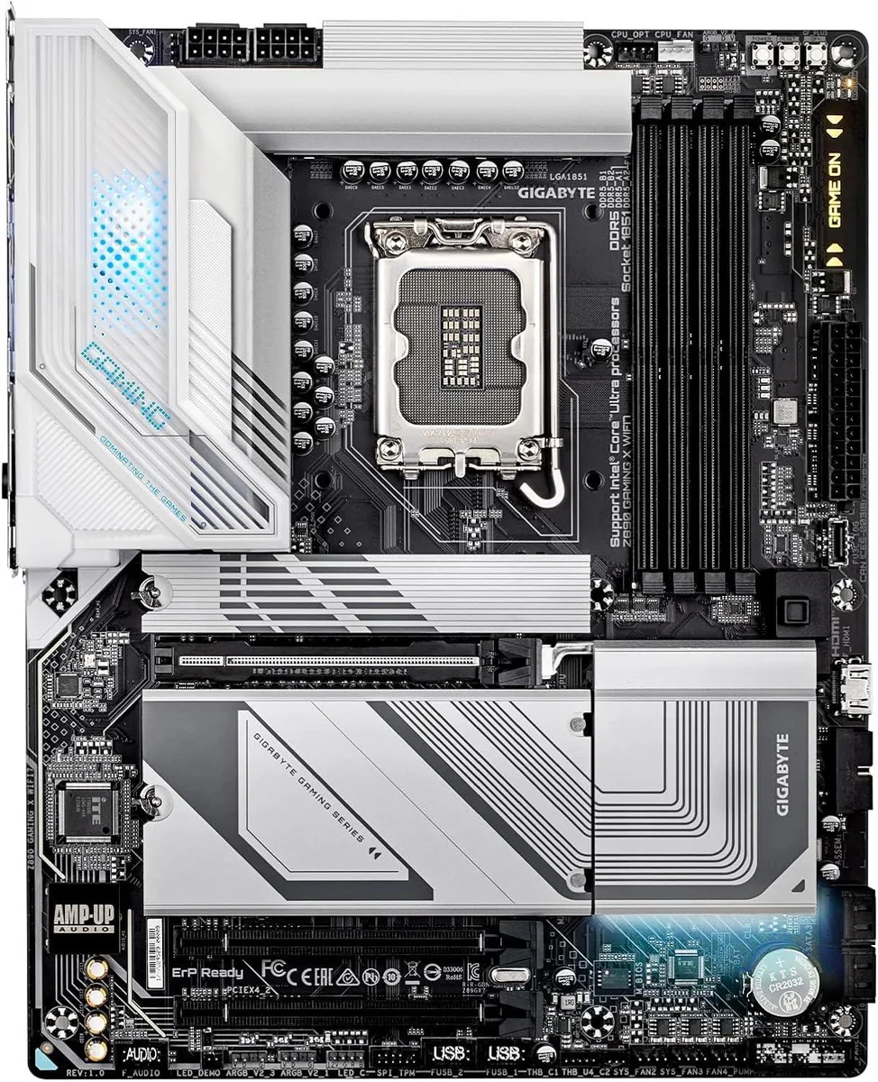 Green ATX motherboard with silver heatsinks and black I/O shield