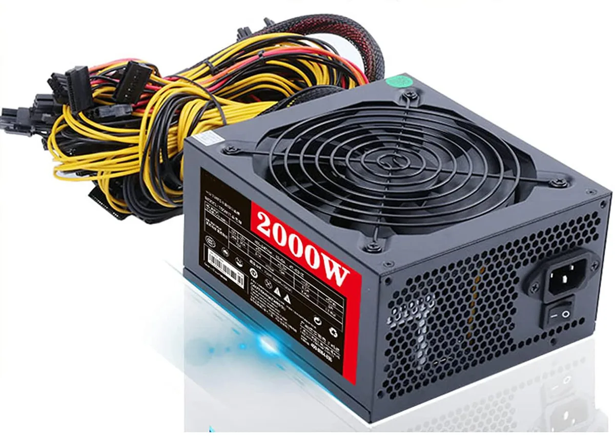 Black rectangular AT power supply unit with bird's nest ventilation holes and modular cables visible