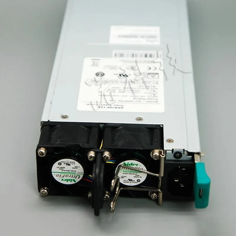 Rectangular ATX power supply unit with matte black metal casing and rear fan grille