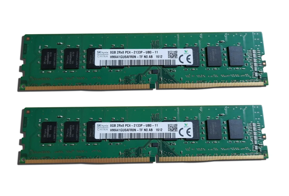 Two green DDR4 DIMMs with black chips and gold contacts