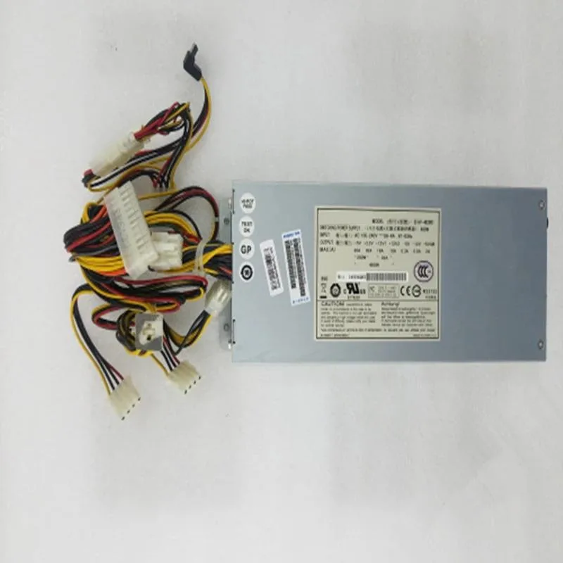 Silver 2U ATX power supply unit with rear fan grille and cable bundle