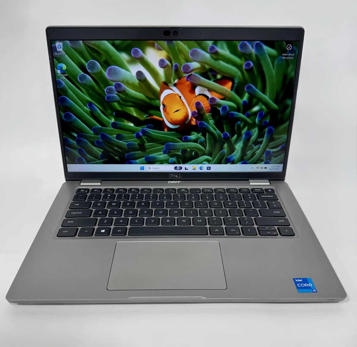 Gray Dell Latitude 5420 2-in-1 laptop, 14 inch FHD screen, visible scratches and paint loss on edges