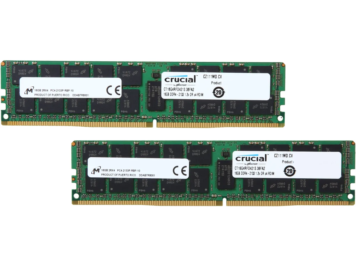 Two green 288-pin DDR4 DIMMs with black heat spreaders and gold contacts