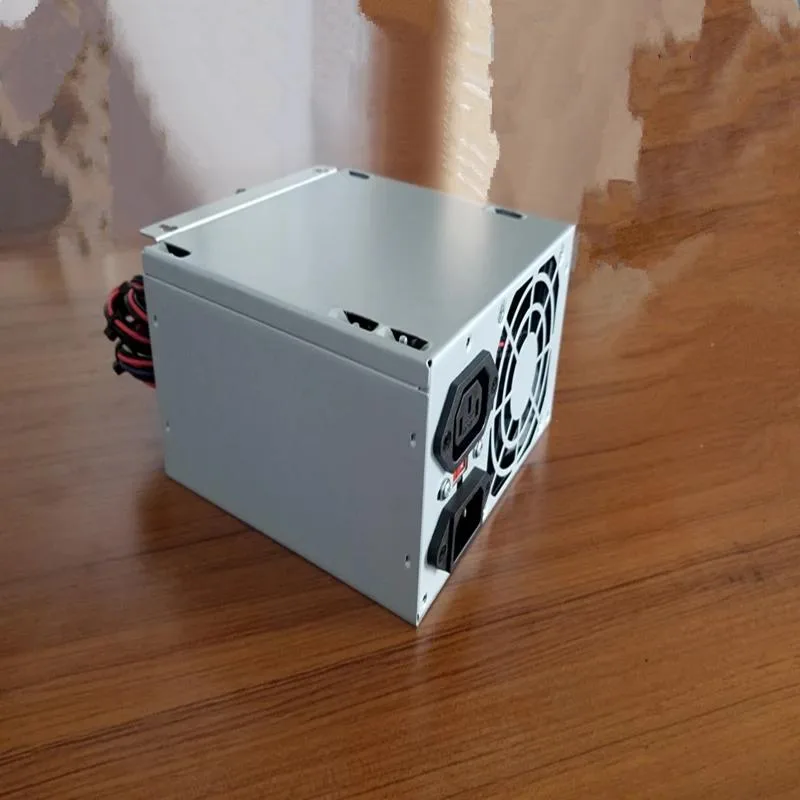 New ATX power supply in black metal case with cooling fan and cable bundle