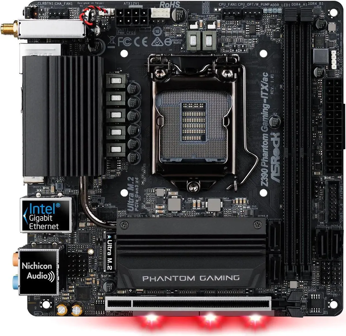 Compact Mini-ITX motherboard with black PCB, silver heatsinks, and rear I/O shield