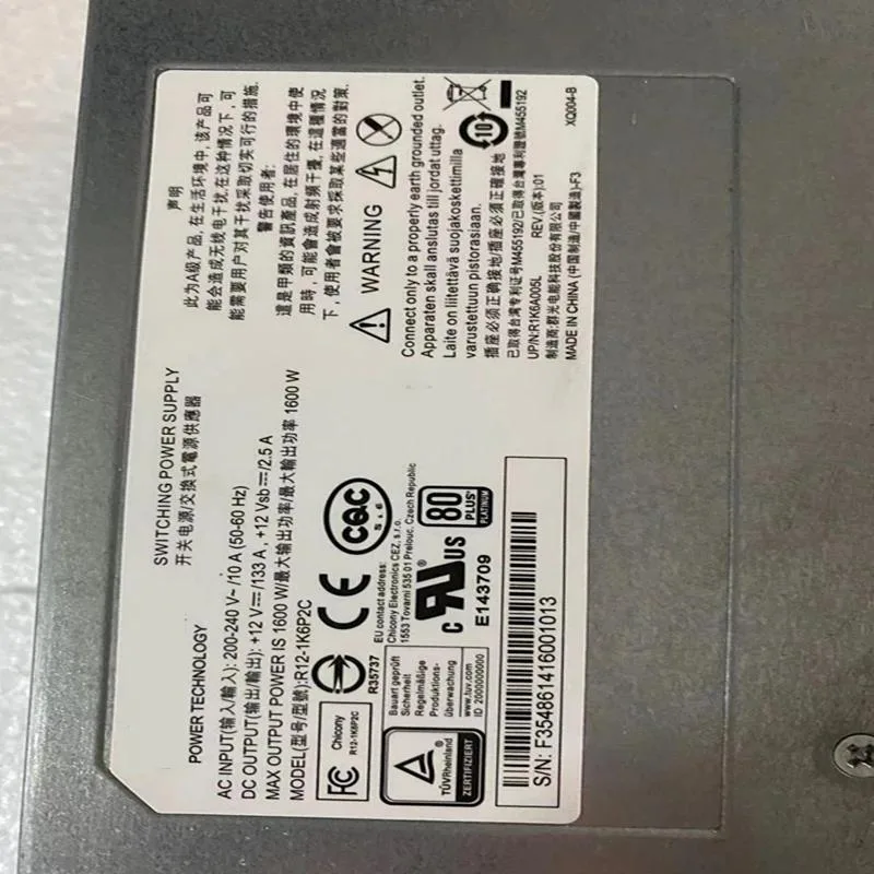 Rectangular silver ATX power supply unit with fan grille and cable connectors