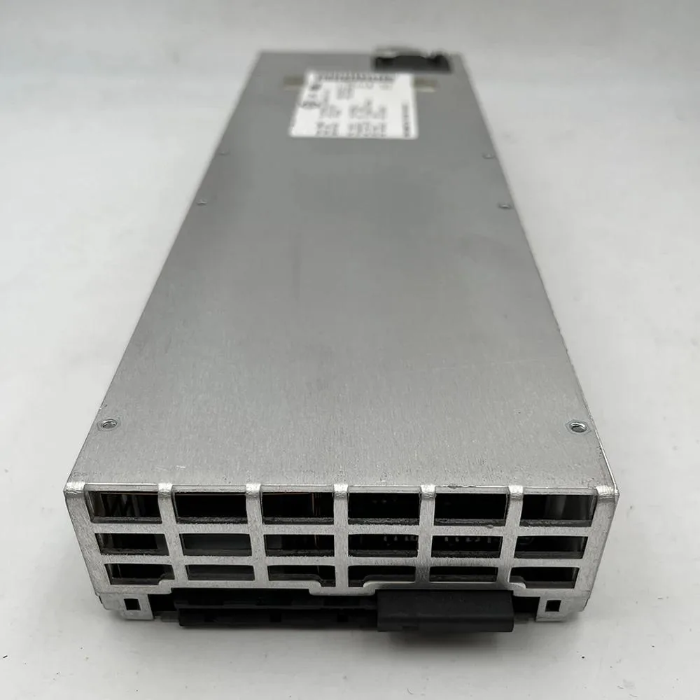 Rectangular silver power supply module with front handle and ventilation slots