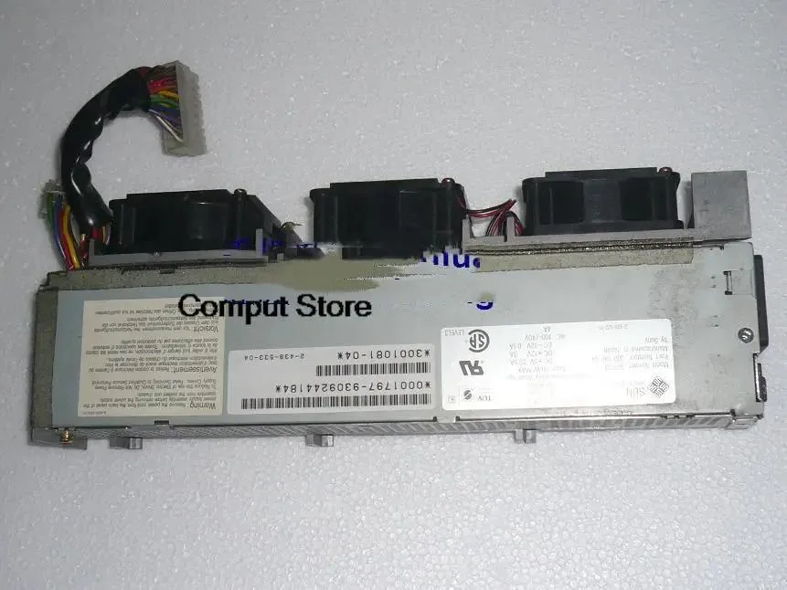 Rectangular metal ATX power supply unit with ventilation grille and label showing APS-39300-1081-04