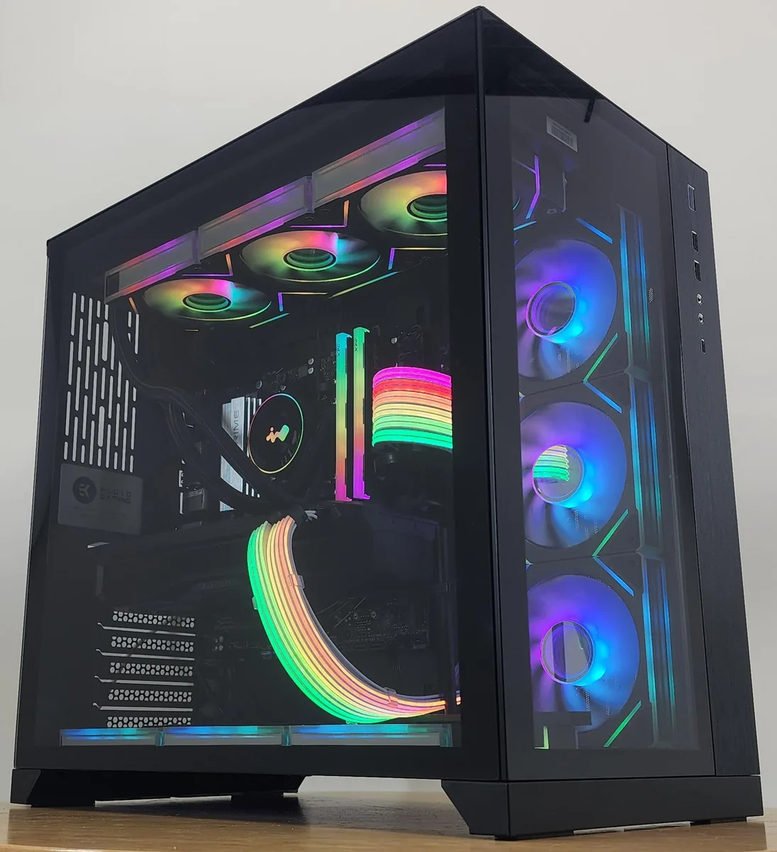 Black Lian Li O11 Dynamic case with 360mm RGB AIO cooler and RX 7900 XT graphics card visible through tempered glass side panel