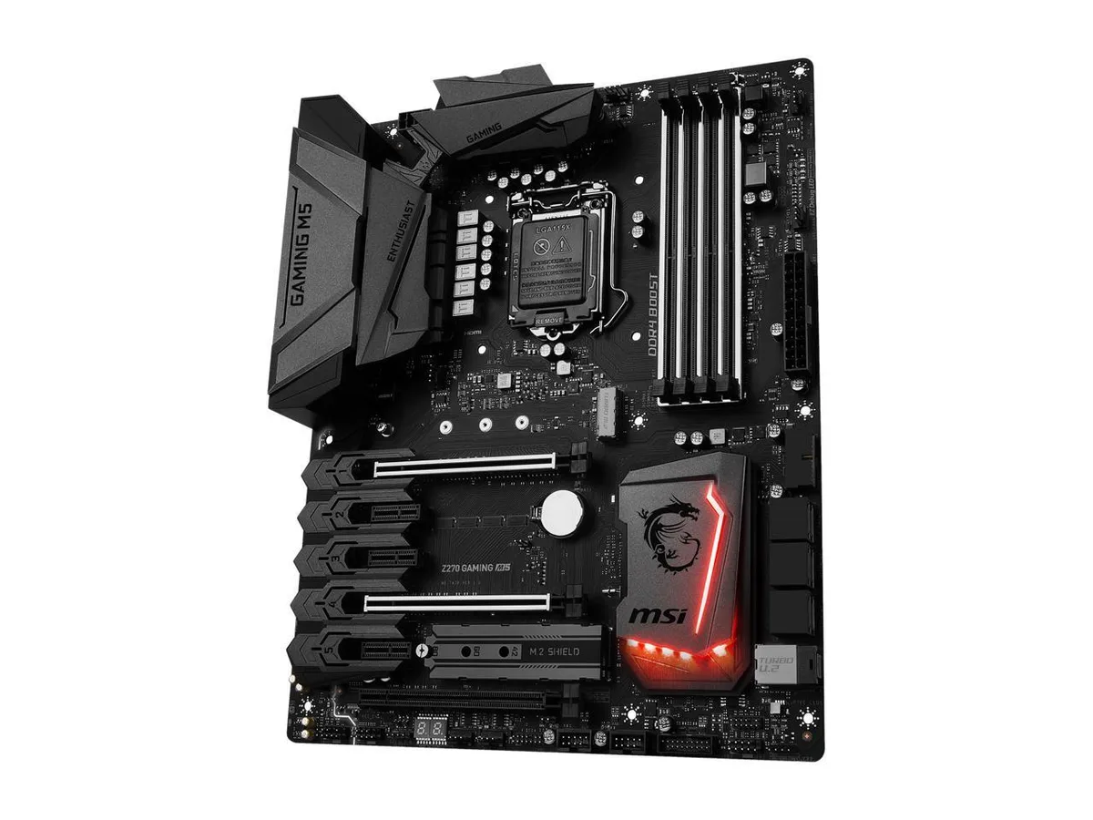 ATX motherboard in black with red accents, silver heatsinks and reinforced PCIe slots