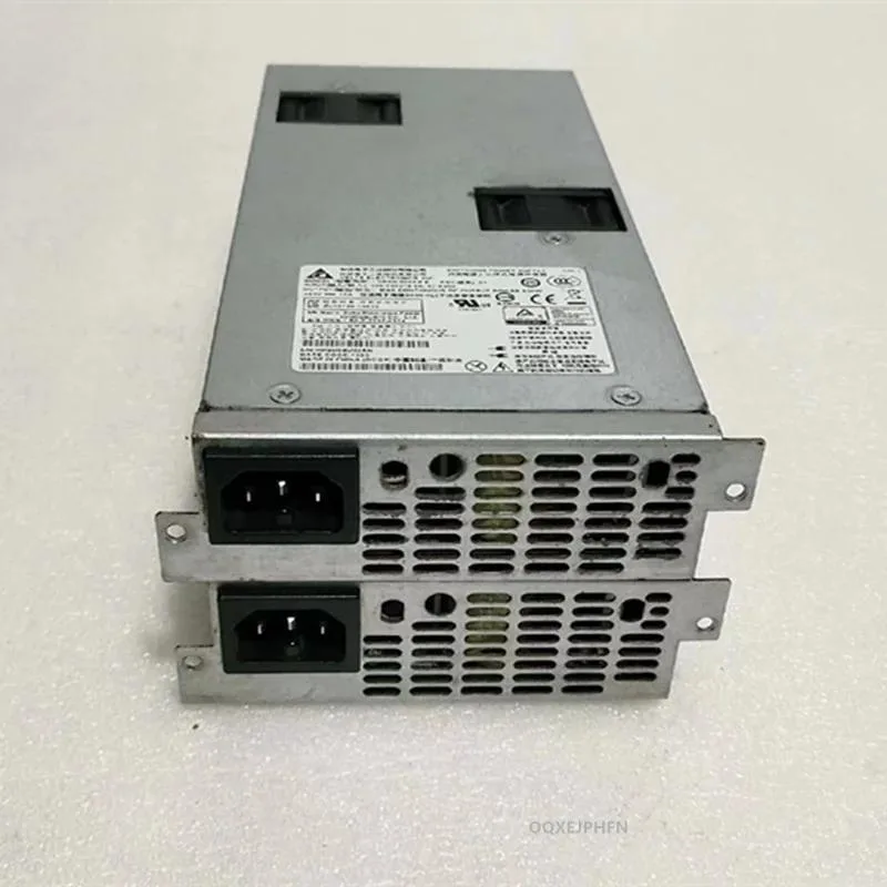Rectangular ATX power supply unit with matte black metal casing and cooling fan grille