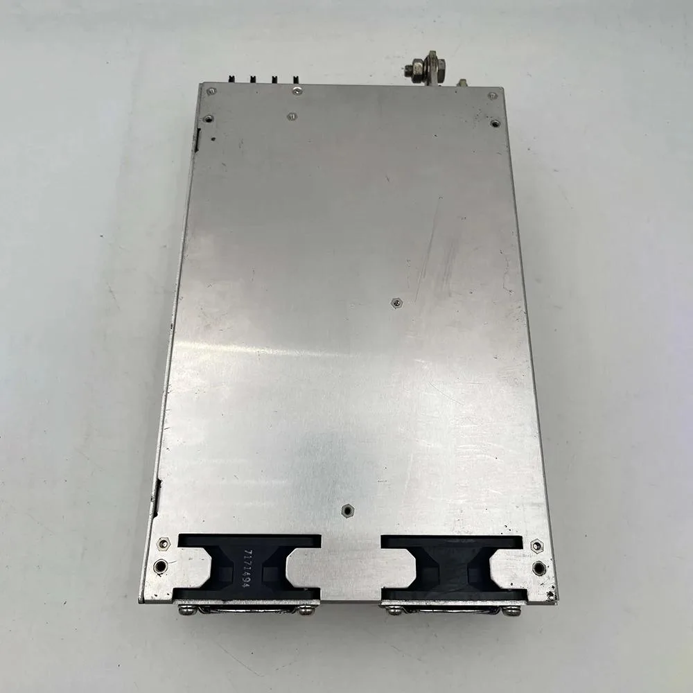 Silver rectangular ATX power supply unit with cooling fan and terminal connections