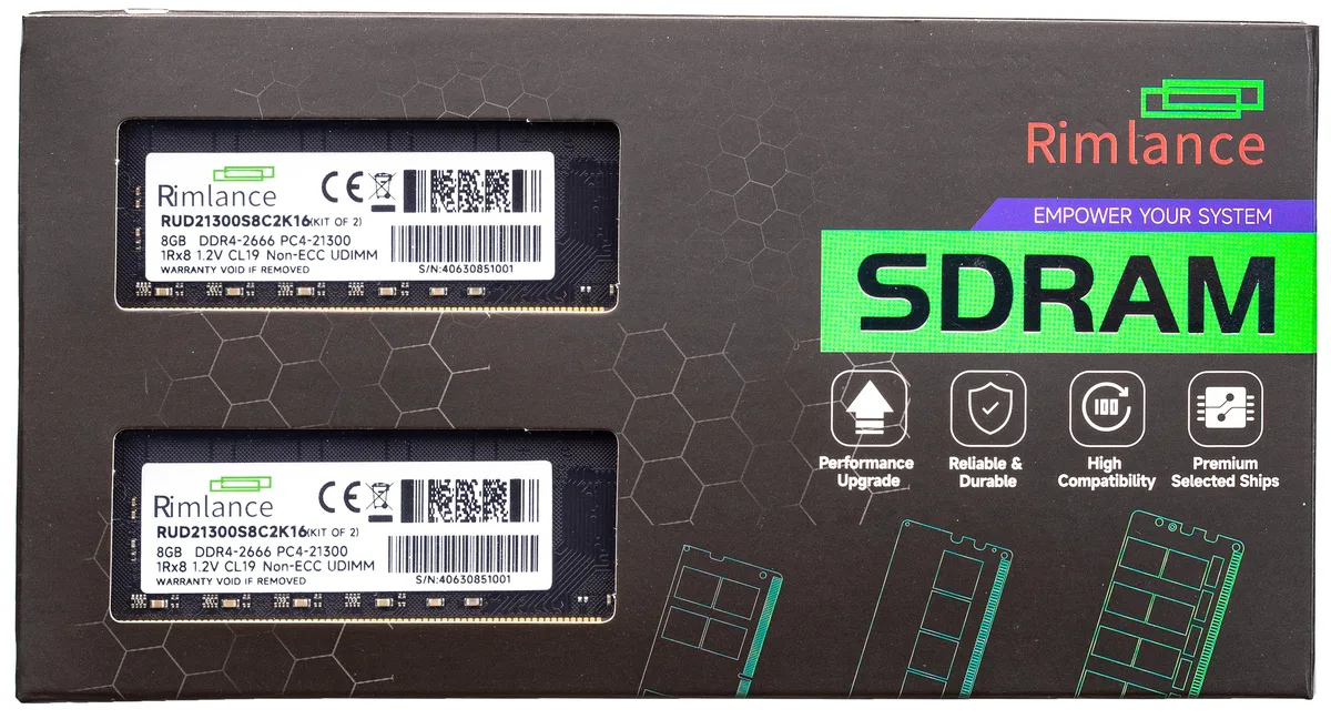 Two green circuit boards with black memory chips and gold edge connectors