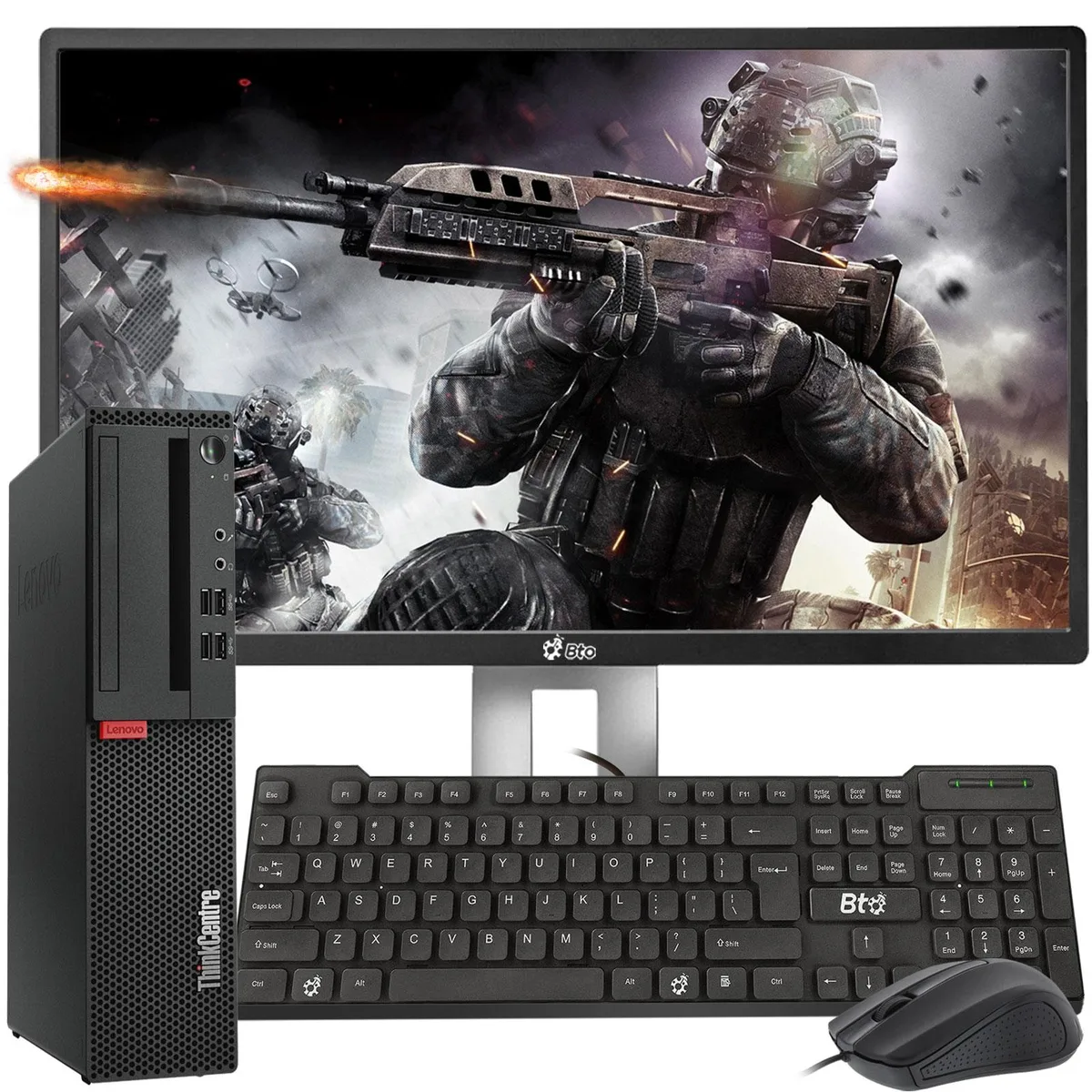 Black small-form-factor desktop tower beside a 24 inch monitor with keyboard and mouse