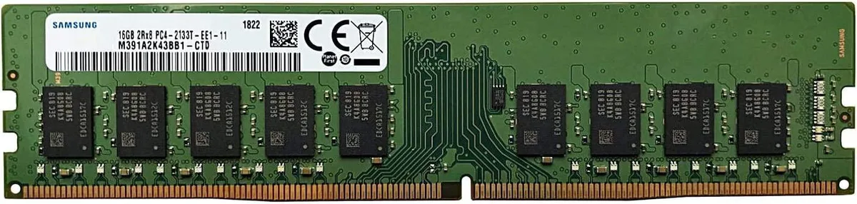 Green circuit board with black memory chips and gold edge connector