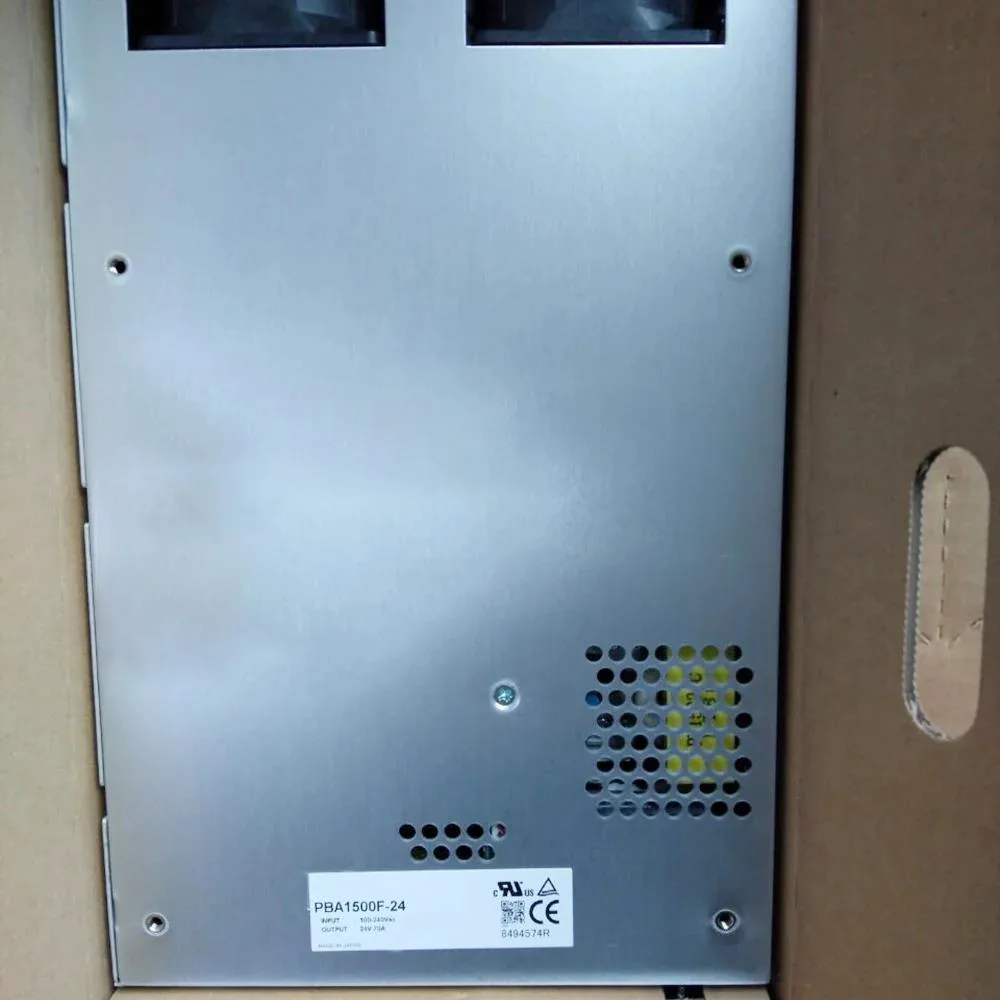 Rectangular silver ATX power supply unit with rear fan grille and side label