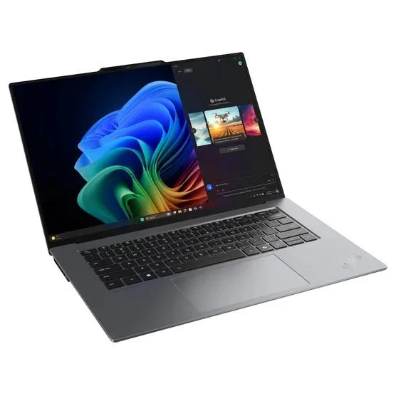 Silver aluminium laptop with 15.3 inch OLED screen, white backlit keyboard, haptic touchpad, fingerprint reader on power button